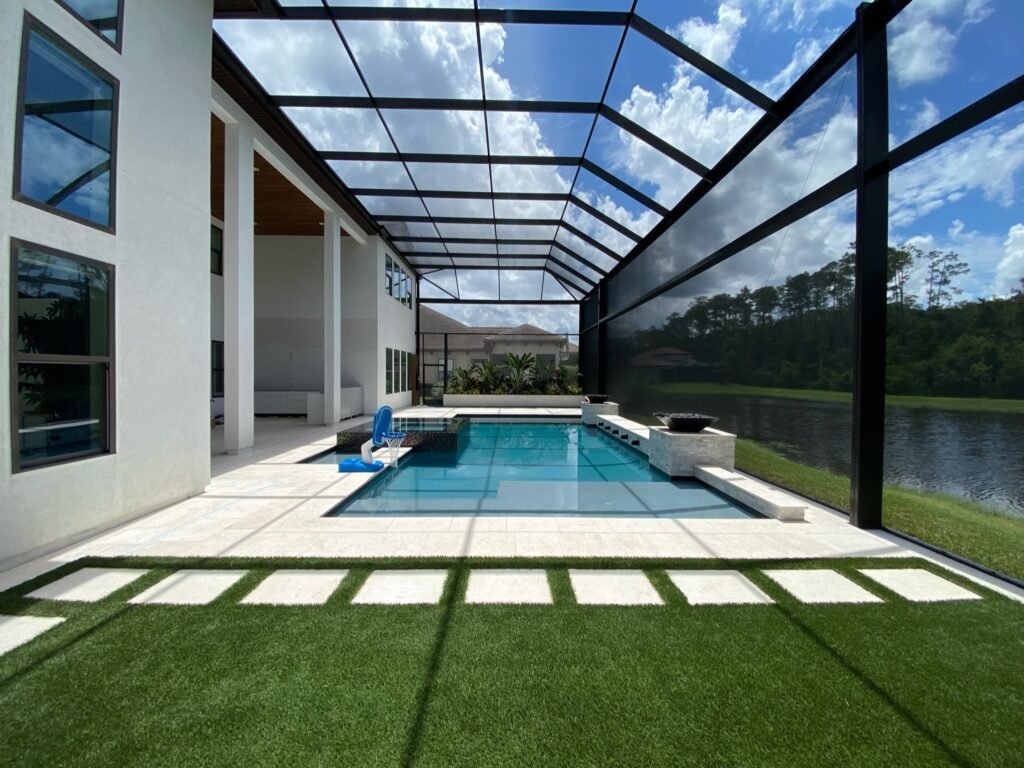 Modern pool screen enclosure installation in Port St. Lucie, FL waterfront home
